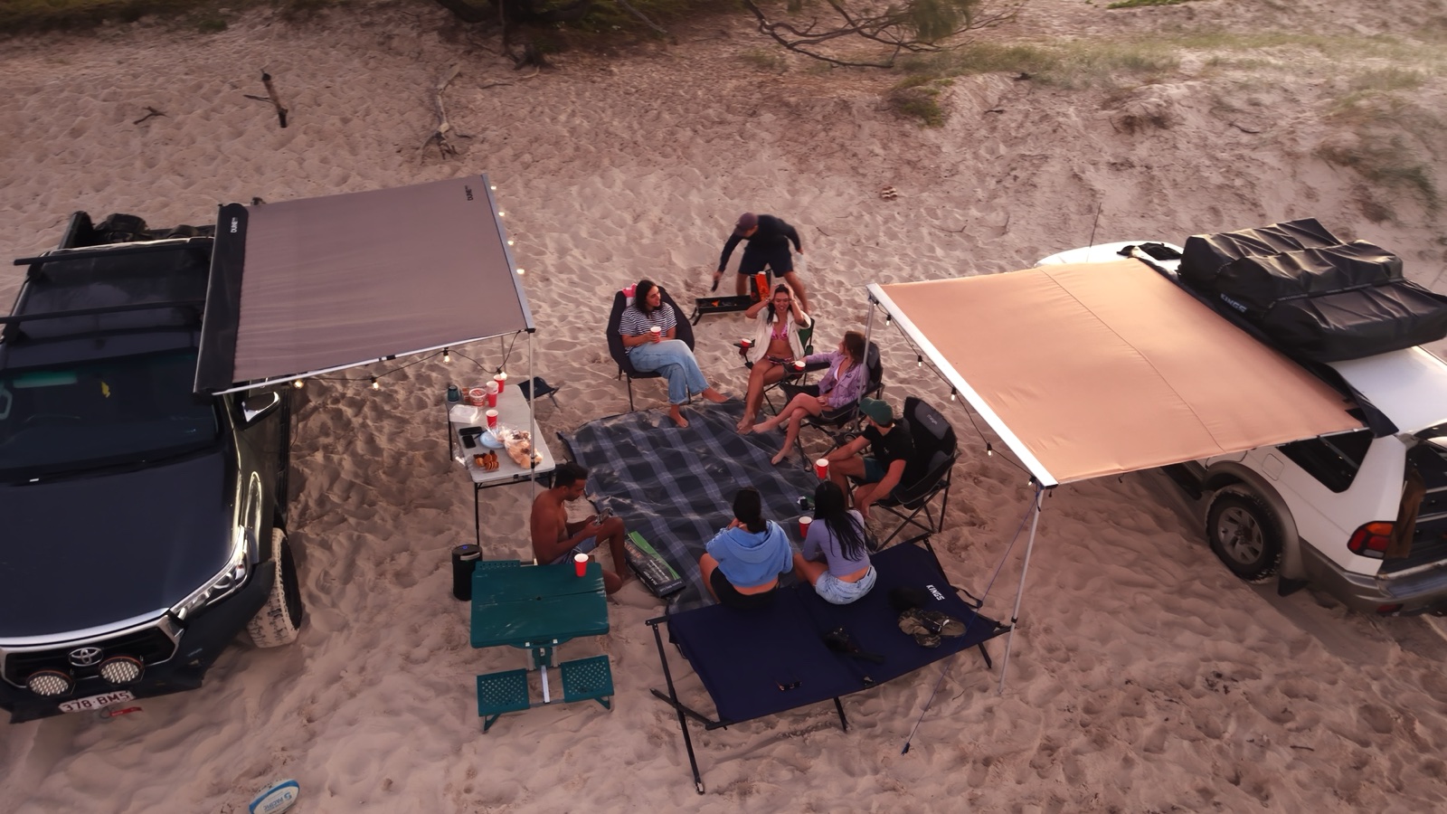 Travellers setting up camp together on the island